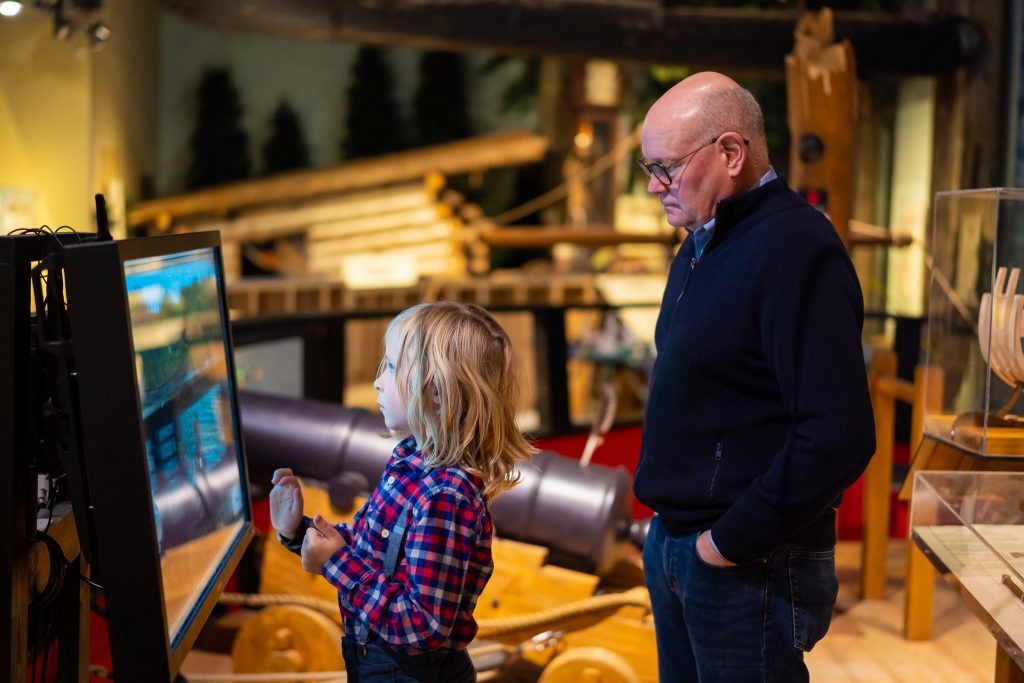 Photo of man and boy with interactive game