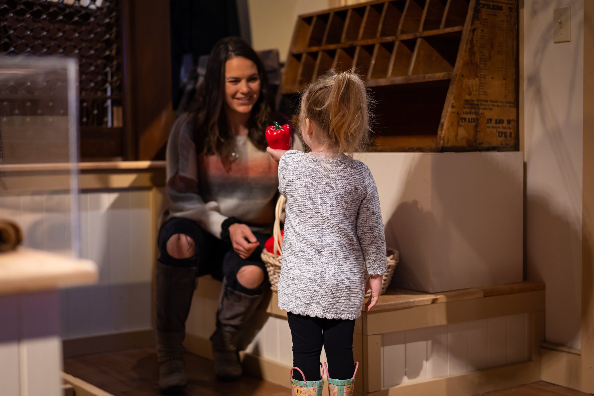 mother and daughter playing in the general store