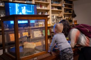 Mom and son watching the interactive screen