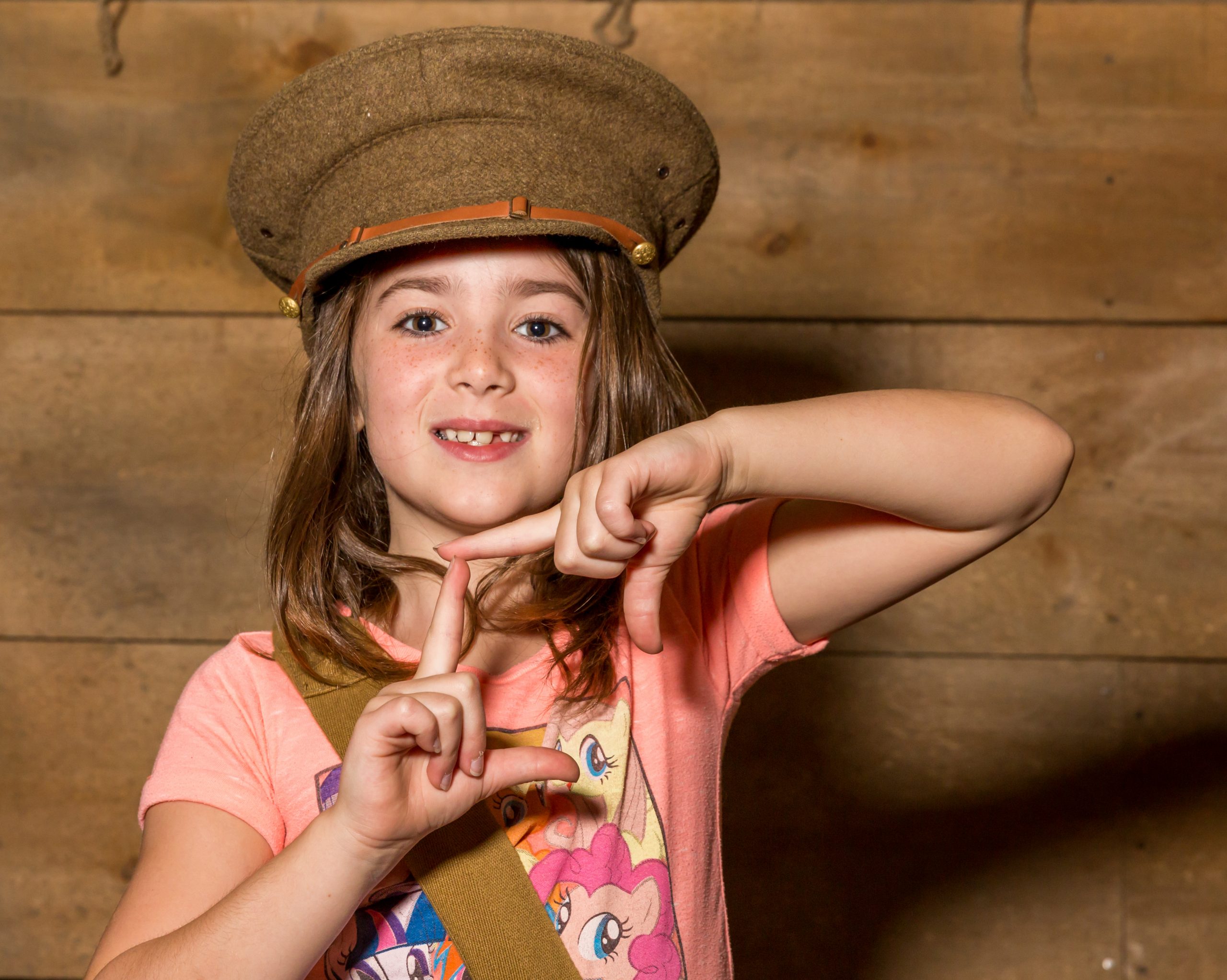 Image of girl dressed in soldiers hat