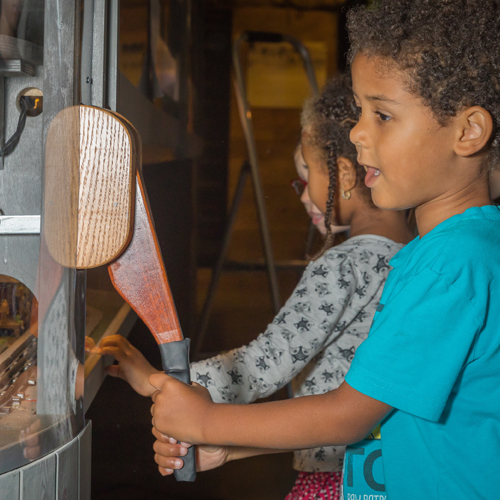 Image of a young boy watching the train