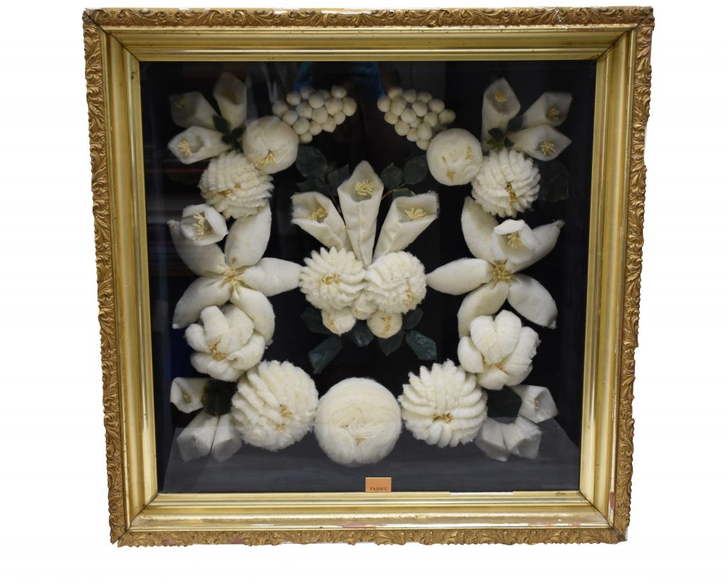 Image of a shadow box with a handmade wreath