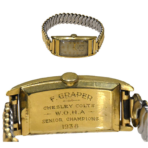 Watch and close up of engraving on back