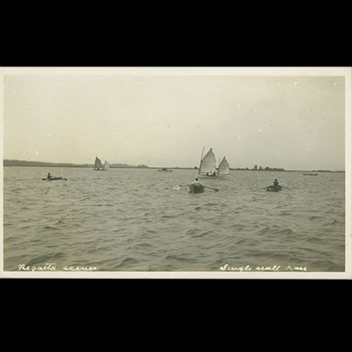 People racing in small boats