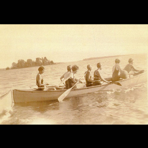 Ladies in large canoe.