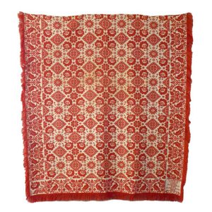 Red and cream coverlet