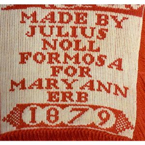 Maker's name and date on coverlet.