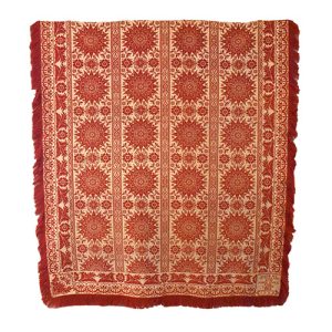 Red and cream coverlet