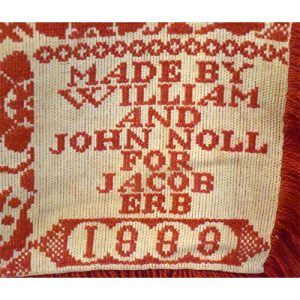Name and date on coverlet.