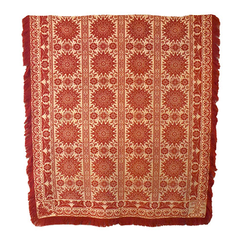 Red and cream coverlet
