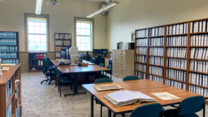 The research Room, showing tables, computers and bookshelves.