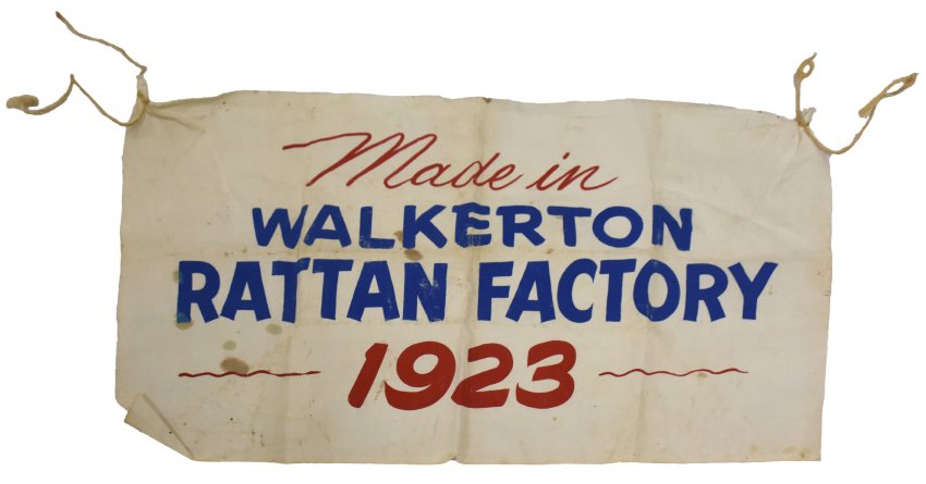 Banner featuring words "Made in Walkerton Rattan Factory 1923 with blue and red lettering.