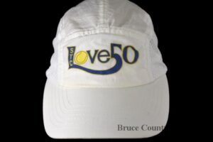 White Tennis Hat that reads "Love 50"