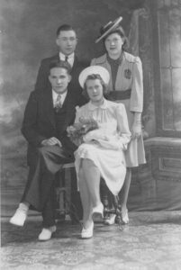 Four People sitting for a photo