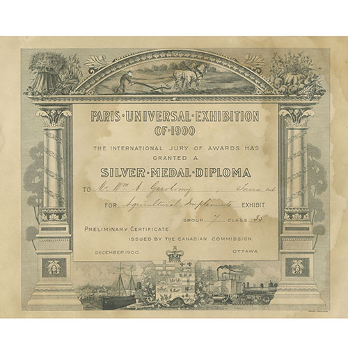 Certificate from Paris Universal Exhibition of 1900 awarding a Silver Medal Diploma to W.A. Gerolamy. for Agricultural Implements exhibit. The document features ornate columns, agricultural and industrial illustrations,